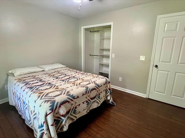 831 Harris Rd, Dickson, TN 37055 - bedroom featuring dark wood-style floors, baseboards, a walk in closet, and ceiling fan