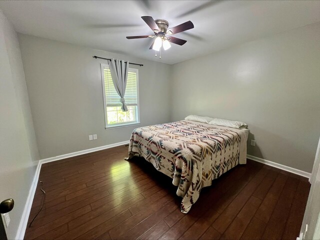 831 Harris Rd, Dickson, TN 37055 - bedroom featuring dark wood-style flooring, baseboards, and a ceiling fan