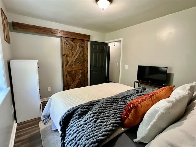 831 Harris Rd, Dickson, TN 37055 - bedroom with wood finished floors and a barn door