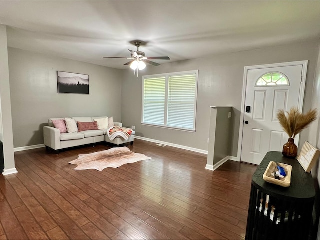 831 Harris Rd, Dickson, TN 37055 - living area featuring baseboards, ceiling fan, and dark wood-style flooring