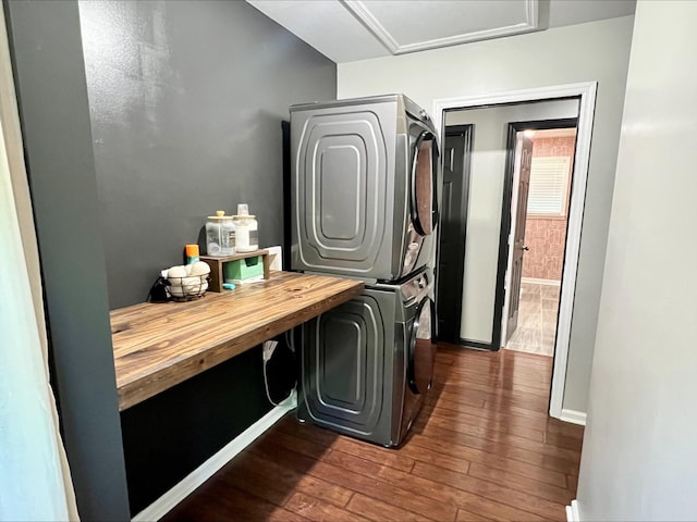 831 Harris Rd, Dickson, TN 37055 - laundry area with stacked washer and clothes dryer, dark wood-style flooring, baseboards, and attic access