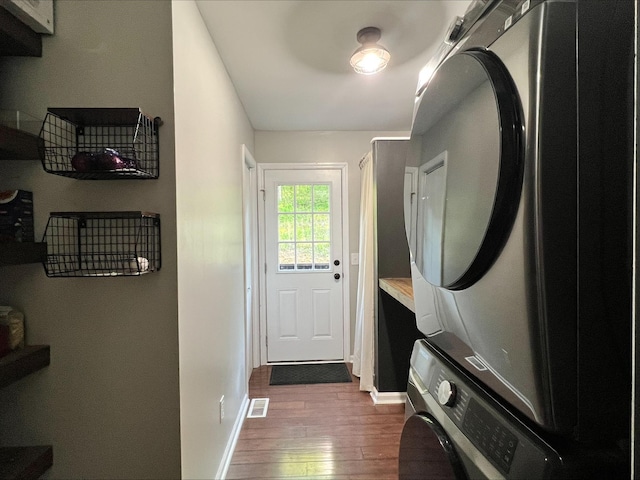 831 Harris Rd, Dickson, TN 37055 - entryway with stacked washer and clothes dryer, dark wood-style floors, and baseboards