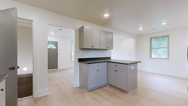 110 Lynn Ln, Old Hickory, TN 37138 - kitchen with light wood-style floors, gray cabinets, dark countertops, a peninsula, and recessed lighting