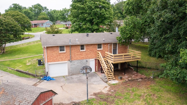 110 Lynn Ln, Old Hickory, TN 37138 - rear view of house featuring brick siding, stairs, a deck, driveway, and an attached garage