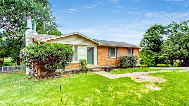 110 Lynn Ln, Old Hickory, TN 37138 - view of front of property with a chimney, brick siding, and roof with shingles