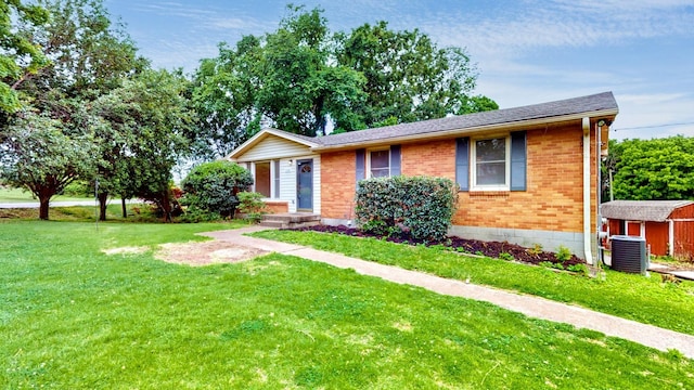 110 Lynn Ln, Old Hickory, TN 37138 - view of front of house featuring brick siding, central air condition unit, and a front lawn