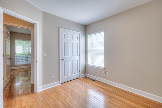 1030 Meandering Way, Franklin, TN 37067 - unfurnished bedroom featuring baseboards and light wood finished floors