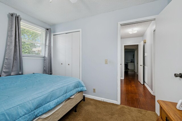 4904 Rainier Dr, Old Hickory, TN 37138 - bedroom featuring a textured ceiling, a closet, baseboards, and carpet floors