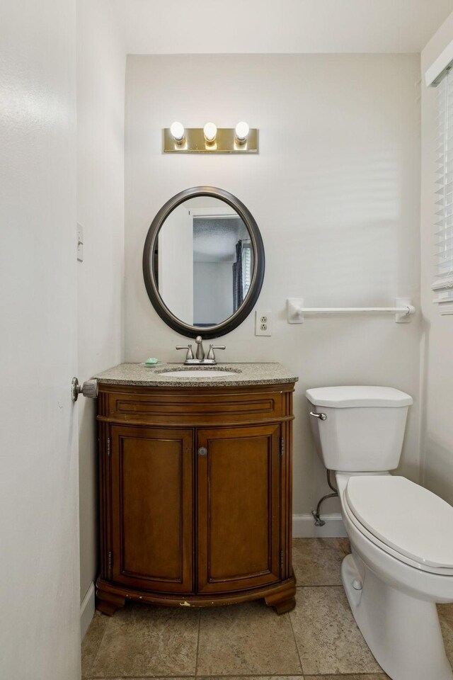 4904 Rainier Dr, Old Hickory, TN 37138 - bathroom with baseboards, vanity, toilet, and tile patterned flooring