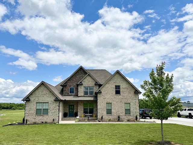 2092 Longview Rd, Bell Buckle, TN 37020 - craftsman house featuring a front lawn, a porch, and brick siding