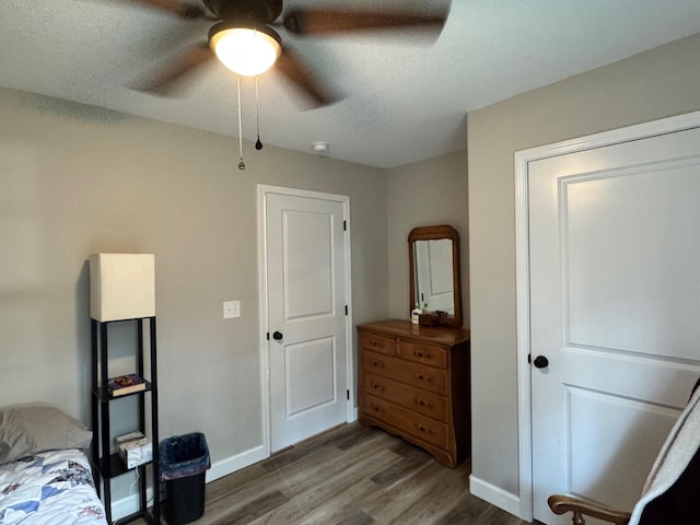 111 Stellar Ct, Clarkrange, TN 38553 - bedroom featuring wood finished floors, baseboards, ceiling fan, and a textured ceiling