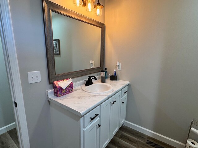 111 Stellar Ct, Clarkrange, TN 38553 - bathroom featuring vanity, wood finished floors, and baseboards