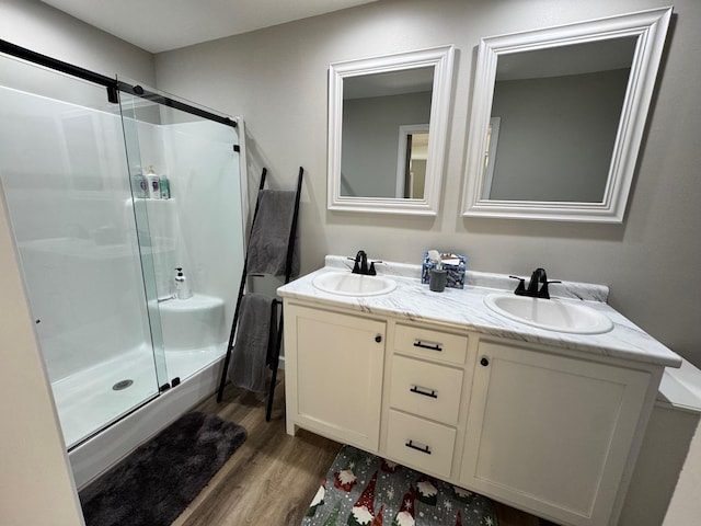 111 Stellar Ct, Clarkrange, TN 38553 - bathroom with wood finished floors, a stall shower, and double vanity