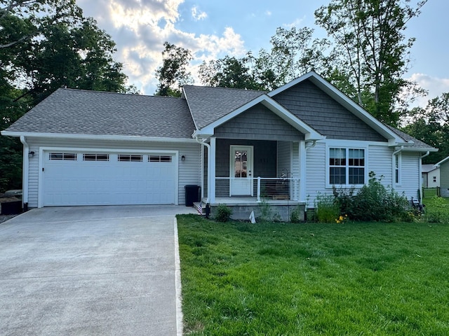 111 Stellar Ct, Clarkrange, TN 38553 - view of front of home featuring a porch, a garage, driveway, a front lawn, and a shingled roof