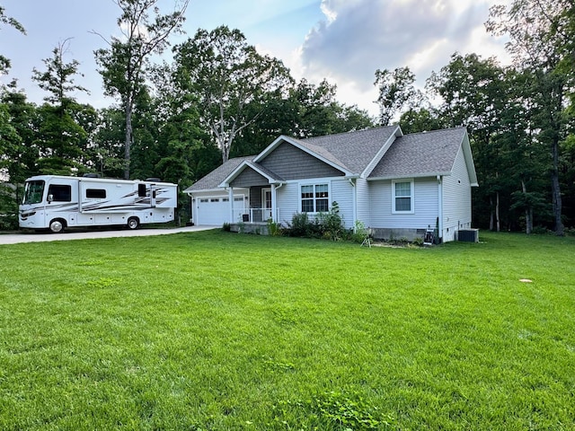 111 Stellar Ct, Clarkrange, TN 38553 - view of front of home featuring cooling unit, an attached garage, a front lawn, driveway, and roof with shingles
