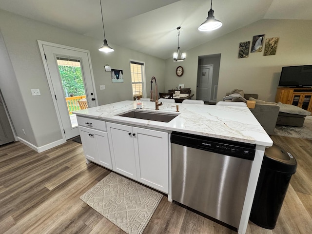 111 Stellar Ct, Clarkrange, TN 38553 - kitchen with stainless steel dishwasher, a sink, open floor plan, wood finished floors, and vaulted ceiling