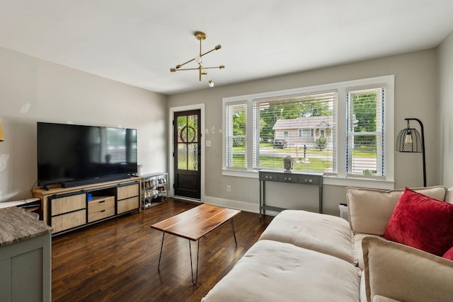 807 Brown St, Columbia, TN 38401 - living room with a chandelier, dark wood-style floors, and baseboards