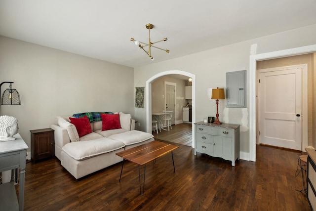 807 Brown St, Columbia, TN 38401 - living area with arched walkways, electric panel, dark wood-type flooring, a chandelier, and baseboards