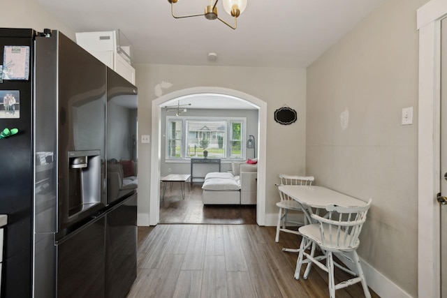 807 Brown St, Columbia, TN 38401 - dining space featuring wood finished floors, arched walkways, a chandelier, and baseboards