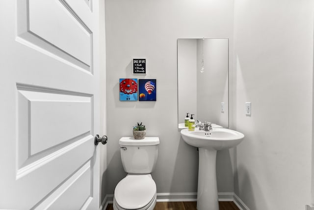 2563 Drumwright Way, Columbia, TN 38401 - bathroom with toilet, baseboards, a sink, and wood finished floors