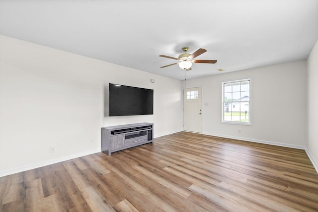 157 Bob White Trl, Oak Grove, KY 42262 - unfurnished living room featuring light wood-style flooring, ceiling fan, and baseboards