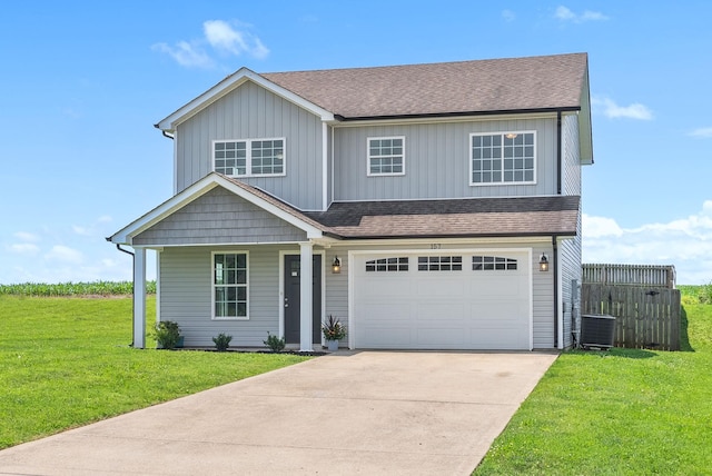 157 Bob White Trl, Oak Grove, KY 42262 - view of front of property featuring concrete driveway, roof with shingles, central air condition unit, and a front yard