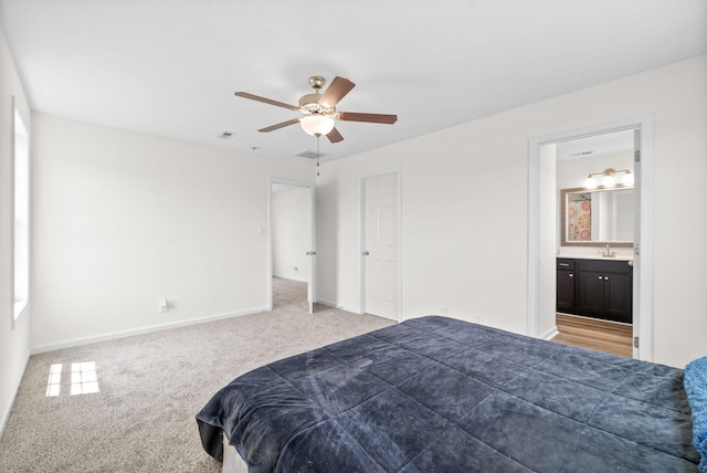157 Bob White Trl, Oak Grove, KY 42262 - carpeted bedroom with baseboards, a sink, ensuite bathroom, and ceiling fan