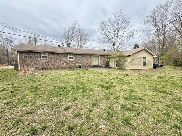 345 Lockert Pl, Clarksville, TN 37043 - rear view of property with a yard and brick siding