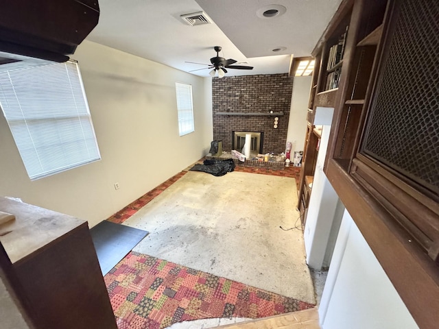 345 Lockert Pl, Clarksville, TN 37043 - living area featuring a ceiling fan, concrete floors, and a fireplace