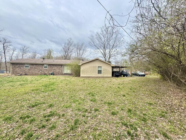 345 Lockert Pl, Clarksville, TN 37043 - view of green lawn with an attached carport