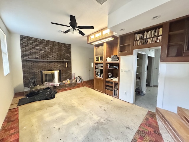345 Lockert Pl, Clarksville, TN 37043 - living room with concrete flooring, a fireplace, and a ceiling fan