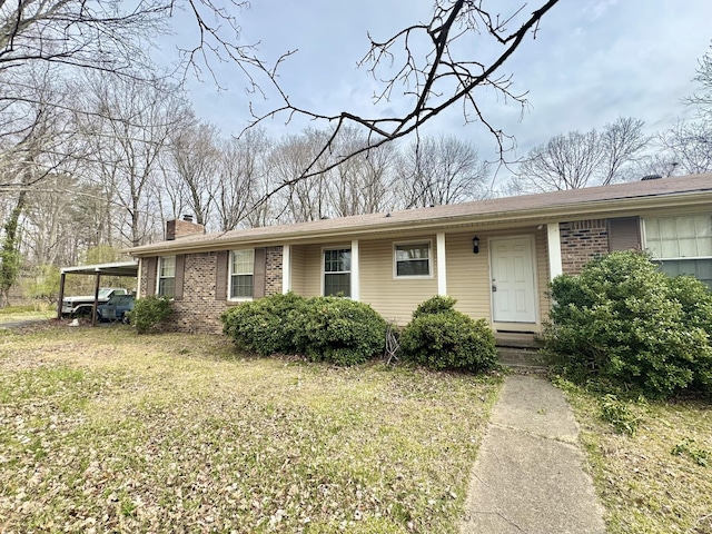 345 Lockert Pl, Clarksville, TN 37043 - ranch-style home featuring a chimney, brick siding, and a carport