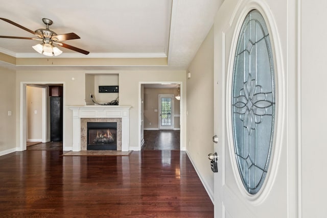 1056 Orion Jones Rd, Chapmansboro, TN 37035 - foyer entrance with wood finished floors, ceiling fan, a tiled fireplace, and crown molding