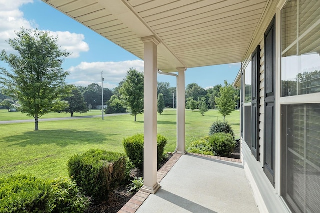 1056 Orion Jones Rd, Chapmansboro, TN 37035 - covered porch with a yard and view of scattered trees