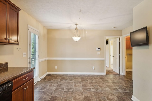 1056 Orion Jones Rd, Chapmansboro, TN 37035 - unfurnished dining area with baseboards and stone finish floors