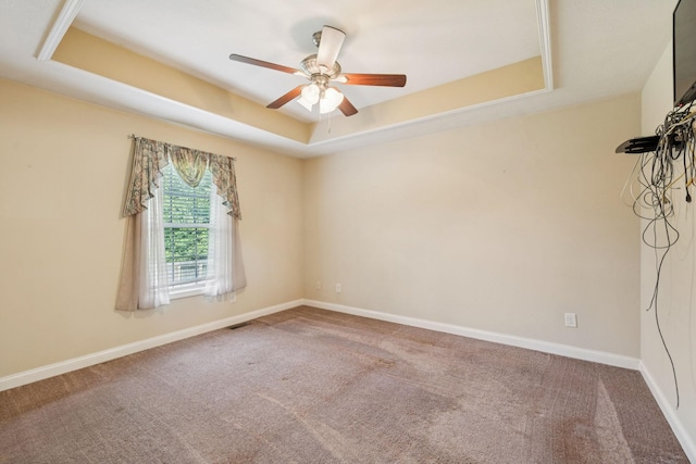 1056 Orion Jones Rd, Chapmansboro, TN 37035 - empty room featuring a tray ceiling, ceiling fan, and carpet floors