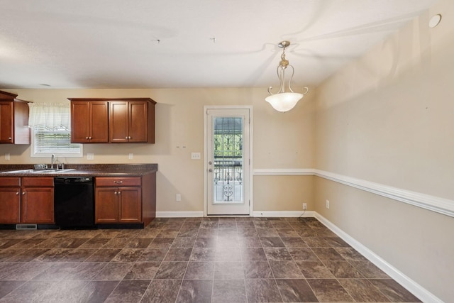 1056 Orion Jones Rd, Chapmansboro, TN 37035 - kitchen with dishwasher, plenty of natural light, dark countertops, and brown cabinetry
