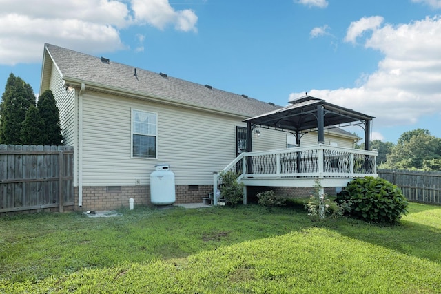 1056 Orion Jones Rd, Chapmansboro, TN 37035 - back of property featuring a gazebo, crawl space, a fenced backyard, a deck, and a shingled roof