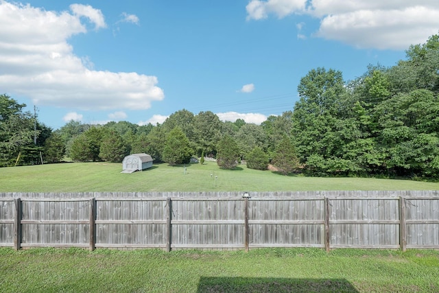 1056 Orion Jones Rd, Chapmansboro, TN 37035 - fenced backyard with an outbuilding