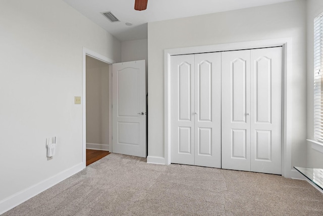 309 Seven Springs Way Unit 404, Brentwood, TN 37027 - unfurnished bedroom with carpet, a closet, baseboards, a ceiling fan, and multiple windows