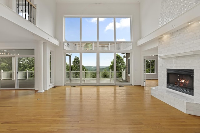 1853 Lafever Ridge Rd, Silver Point, TN 38582 - unfurnished living room featuring a high ceiling, wood finished floors, and a fireplace