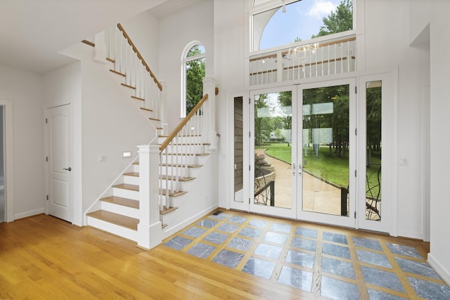 1853 Lafever Ridge Rd, Silver Point, TN 38582 - entryway with stairway, wood finished floors, a high ceiling, french doors, and baseboards
