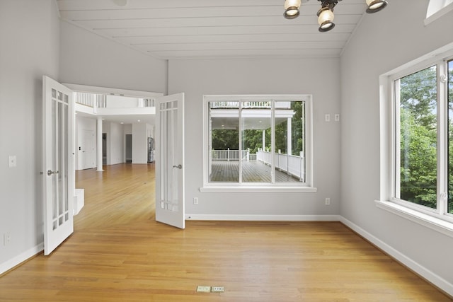 1853 Lafever Ridge Rd, Silver Point, TN 38582 - spare room featuring light wood-type flooring, a chandelier, wood ceiling, baseboards, and vaulted ceiling