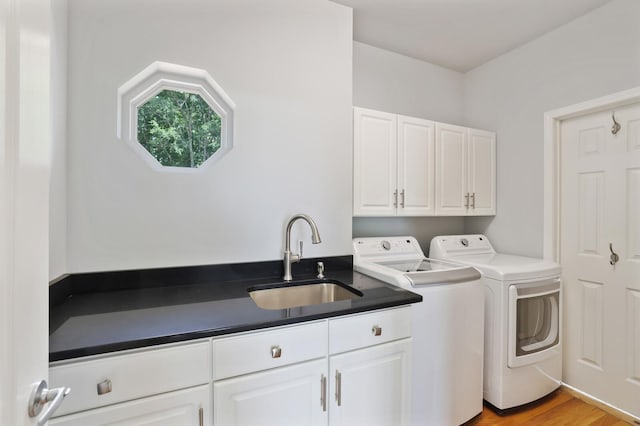 1853 Lafever Ridge Rd, Silver Point, TN 38582 - laundry room with washing machine and clothes dryer, cabinet space, and light wood finished floors