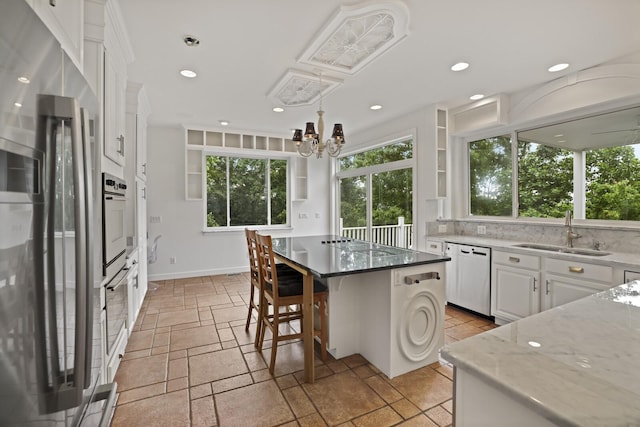 1853 Lafever Ridge Rd, Silver Point, TN 38582 - kitchen featuring stainless steel fridge with ice dispenser, dishwasher, a sink, stone tile flooring, and white cabinetry