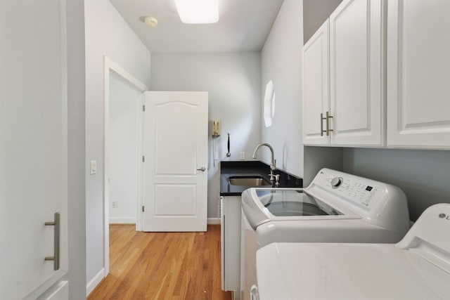 1853 Lafever Ridge Rd, Silver Point, TN 38582 - laundry area with cabinet space, washing machine and dryer, light wood-style floors, and baseboards