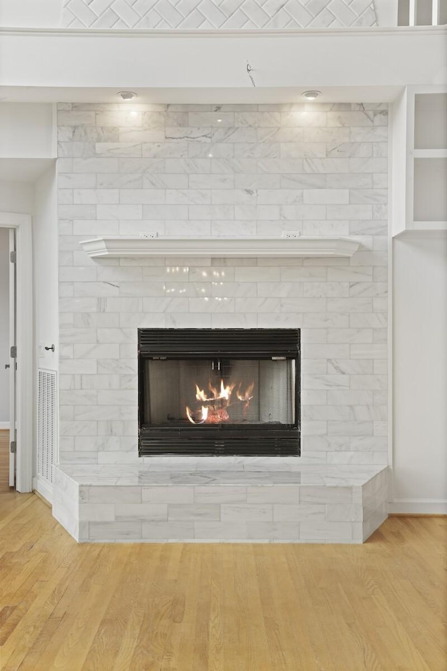 1853 Lafever Ridge Rd, Silver Point, TN 38582 - detailed view of a large fireplace, wood finished floors, and baseboards