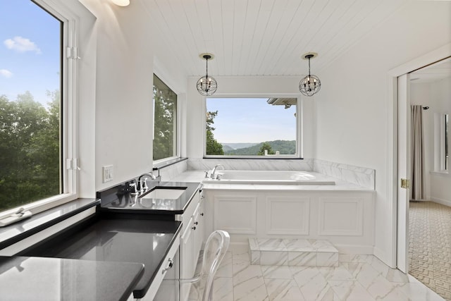 1853 Lafever Ridge Rd, Silver Point, TN 38582 - kitchen featuring a sink, light marble finish flooring, white cabinets, decorative light fixtures, and wooden ceiling