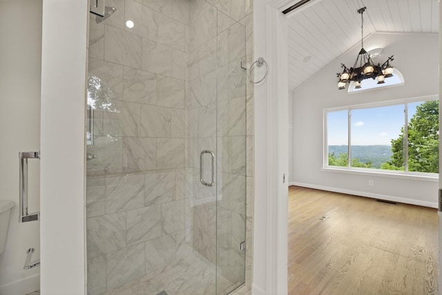 1853 Lafever Ridge Rd, Silver Point, TN 38582 - full bath with a chandelier, a stall shower, wood finished floors, vaulted ceiling, and baseboards