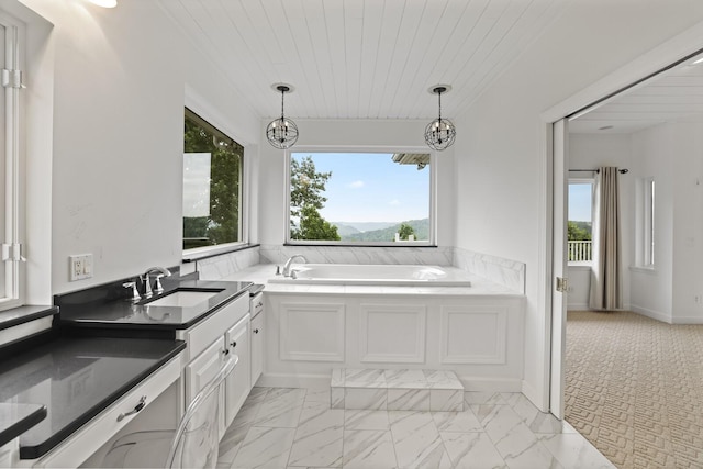 1853 Lafever Ridge Rd, Silver Point, TN 38582 - full bathroom with healthy amount of natural light, a bath, marble finish flooring, vanity, and wooden ceiling
